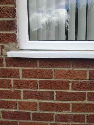 Need a Handyman – Small Crack in Living Room Window